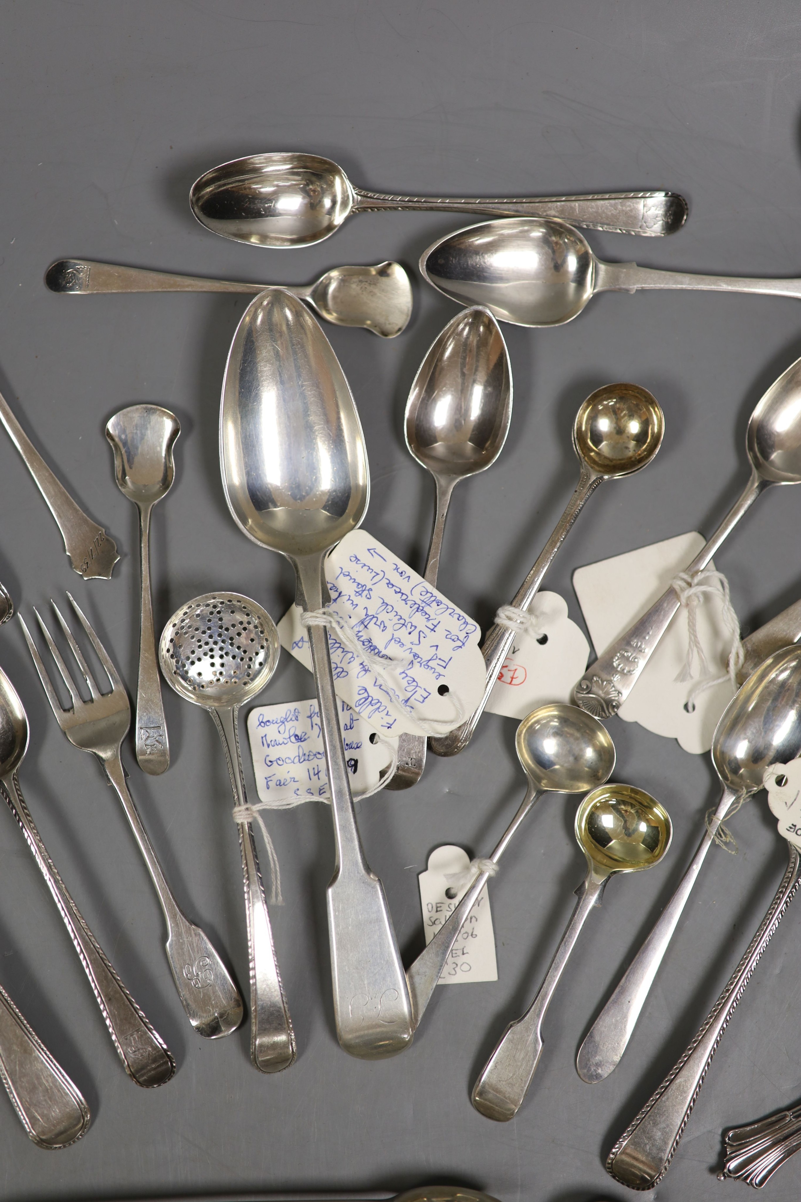 A small quantity of assorted mainly 19th century and later silver flatware including teaspoons, dessert spoon, sugar tongs, butter knife sifter spoon etc. various date and makers, 13.5oz.